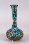AN UNUSUAL PERSIAN ENAMELLED SILVER VASE, inlaid with turquoise stones and pearl, 19cm high.