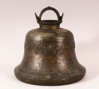 A TIBETAN CAST BRONZE TEMPLE BELL, with a band of calligraphy to the exterior and a possible