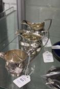 Three silver cream jugs, Birmingham 1894, Chester 1928 and London 1777.