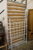 A Victorian style white painted cast iron single bed frame with mattress.