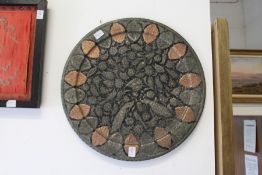 An unusual mixed metal Islamic charger depicting peacocks and other emblems.