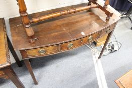 A mahogany bow front side table with a single drawer modelled as three drawers.