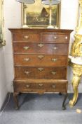 A good 18th century chest on stand, possibly mulberry wood veneered, the sides elm, comprising two