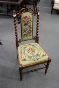 A Victorian rosewood and needlework upholstered occasional chair.
