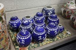 A quantity of prunus pattern ginger jars.