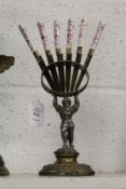 An unusual cast metal figural night holder with a set of six porcelain handled fruit knives.