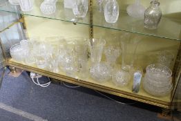 A good collection of cut glass and other jugs, vases, bowls etc.