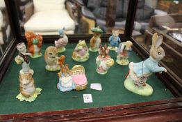 Beatrix Potter figures to include a large Beswick Peter Rabbit, nine small Beswick figures and two