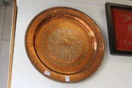 A good embossed and engraved copper charger.