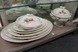 A graduated set of five serving dishes together with a matching vegetable dish and cover and soup