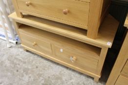 A good modern light oak corner TV stand.