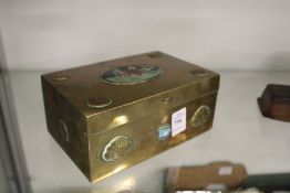 A Chinese brass cigarette box with enamelled decoration.