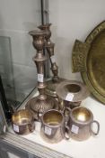 A pair of plated candlesticks and other items.