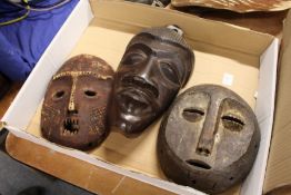 Three wooden masks.