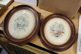 Floral subjects, a pair, framed and glazed ovals.