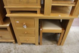 A good modern light oak pedestal dressing table with stool.