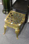 A polished brass footman / stand.