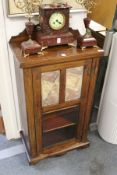 A Victorian rosewood music cabinet.