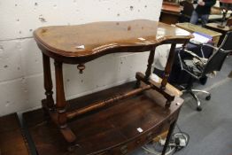 A Victorian walnut low stretcher table.