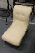 An upholstered small bedroom chair.