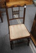 An Edwardian inlaid mahogany child's chair.