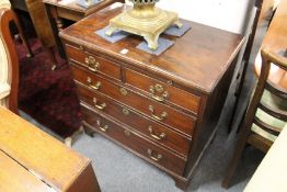 A George III mahogany bachelor's chest with brushing slide, two short and three graduated long