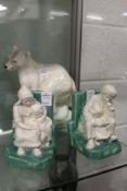 A Royal Doulton polar bear and pair of Bretby bookends (AF).