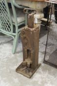 A cast iron crank operated cart / wagon jack.