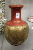 A Japanese vase, red ground with gilt decoration.