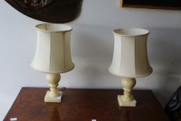 A pair of alabaster table lamps.