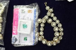 A natural emerald and an Indian gilt metal necklace.