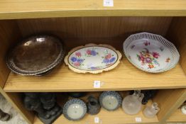 Two floral decorated dishes and a plated bowl.
