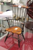 A miniature Windsor style armchair.