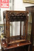 A good nest of Chinese rosewood tables with carved decoration.
