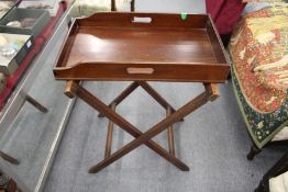 A mahogany butler's tray with associated stand.
