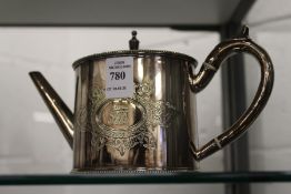 A small plated teapot.