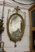A decorative gilt framed mirror.