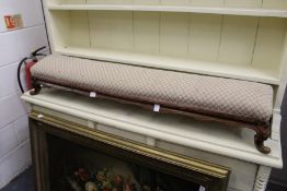 A Victorian walnut fender footstool.