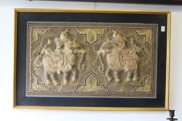 A Thai metal thread embroidered picture of two figures on elephants.