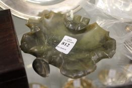 A carved jade leaf shaped brush washer.