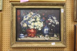 D. Bowman, a still life of flowers in a vase and other items, oil on board, signed, in a