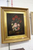 J. Gonzales, a good still life of flowers in a vase on a ledge, in a good decorative gilt frame.