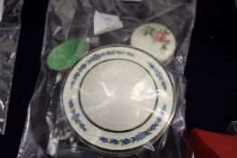 A good silver and enamel circular box together with a similar smaller box and small enamel decorated