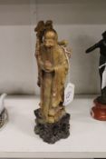 A Chinese carved soapstone figure of Shou Lao.