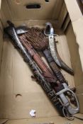 Various eastern daggers, a tomahawk etc.