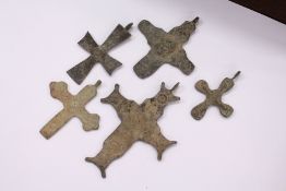 A small bag of early bronze crosses.