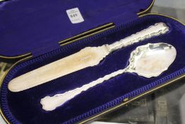 A cased pair of silver fish servers.