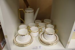 A gilt decorated porcelain coffee service.