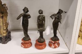 Three small Art Nouveau style bronze figures of ladies on marble bases.