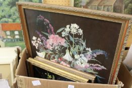 A small group of oil paintings depicting floral subjects and other pictures.